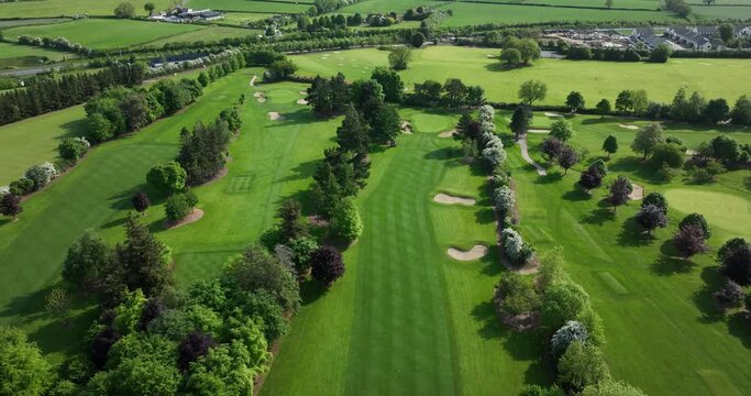 Bird view over Golf course. Aerial top view of golf field in Ireland 4k