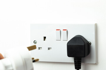 close up of english socket in the wall