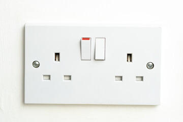 close up of english socket in the wall