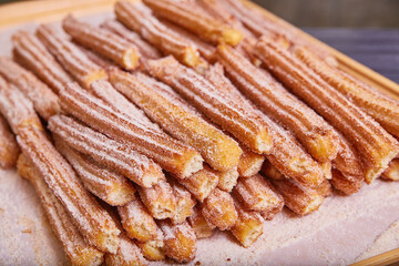 Baked good cinnamon sugar star shaped churros Mexican baked pastry