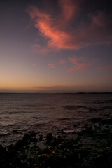 Fototapeta na wymiar Scenic view of sunset over the ocean against sky in summer