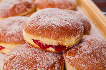 Pile of sweet Mexican baked goods pastry donuts lightly coated in sugar in pile of sweets