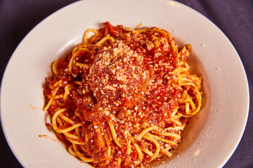Small white bowl kid’s spaghetti and meatball red pasta sauce noodles dish food Italian