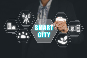 Smart city concept, Person hand touching smart city icon on virtual screen.