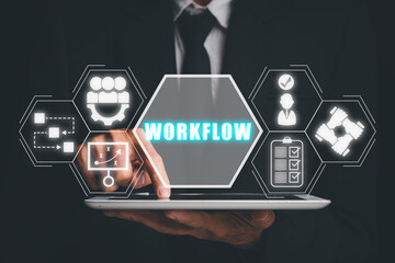 Workflow concept, Businessman using tablet computer with workflow icon on virtual screen.