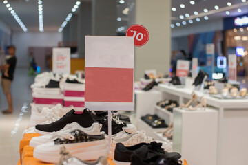 blank red board that can be used for a discount mockup at a sale of women's shoes and sandals