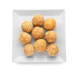 Plate of delicious sesame balls on white background, top view