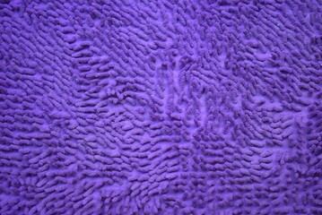 Texture of a purple bath mat