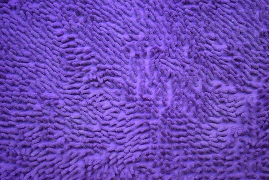 Texture of a purple bath mat