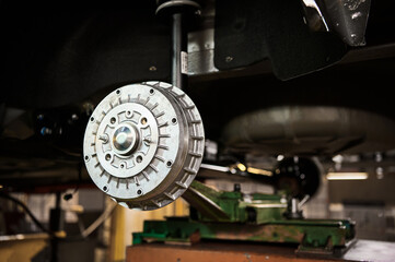Metal brake drum of contemporary automobile in workshop