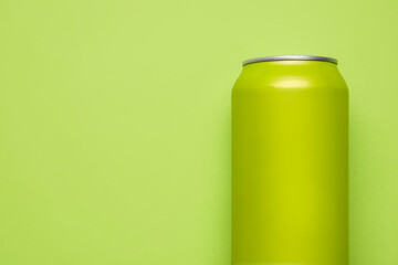 Can of soda on green background, closeup