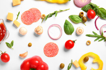 Ingredients for preparing pizza on white background