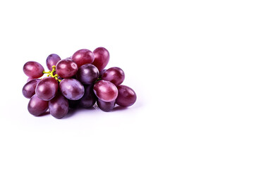 Fototapeta premium Bunch of ripe red grapes isolated on white background with copy space. Created with Generative AI Technology
