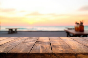 Wooden table top on blur beach background at sunset - can be used for display or montage your products