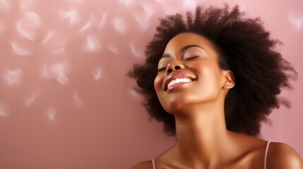 Beauty portrait of african woman smiling on beige background.