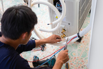Repairman fix air conditioning systems, Air conditioning technicians install new air conditioners...