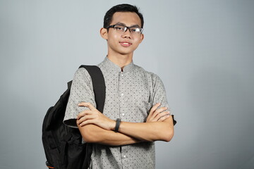 Portrait of a man wearing glasses with black backpack.