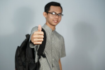 Portrait of a man wearing glasses with black backpack.