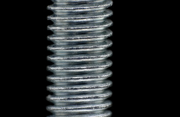 Metal bolt threads, close up macro with shallow DOF.