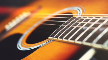 Obraz premium Acoustic guitar close-up, vintage filter.