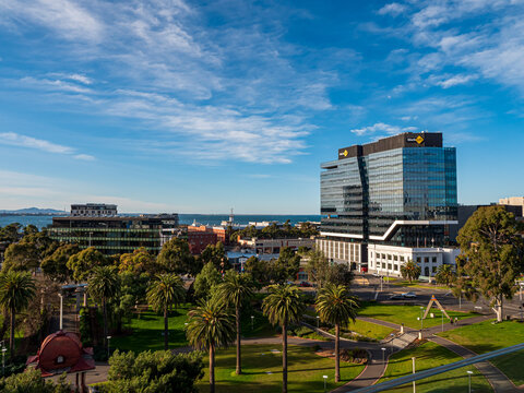 Panoramic view of Geelong from Johnston Park with a sea view and waterfront view. Heritage and modern buildings. Landscape parkland.  Geelong, Victoria, Australia - August 2022.