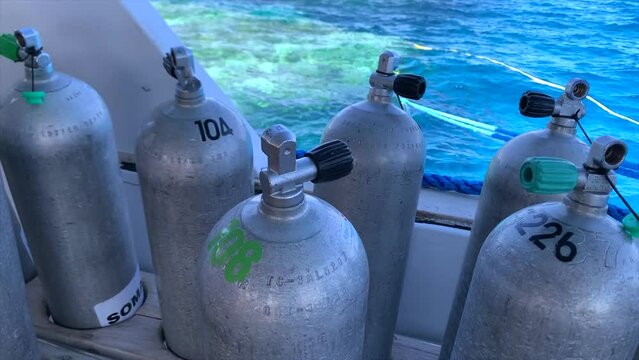oxygen and nitrox tanks on a boat, ready for diving