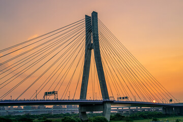 Fototapeta na wymiar Sunset view of Xinbei Bridge in Sanchong District, New Taipei City, Taiwan