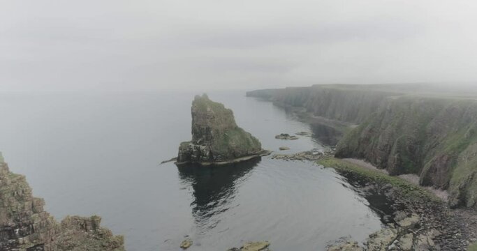 Static drone shot of the Stacks of Duncansby along the Scotland North Coast 500 route at John O'Groats