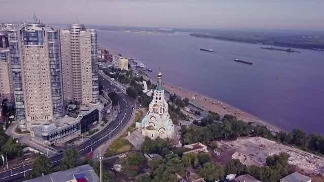Sofiyskiy Sobor church by Volga river coastline beach of Samara, Russia, aerial parallax