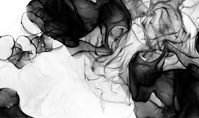 black alcohol ink surface Flowing, isolated, abstract background The art on the wall is stained, the edges are black.