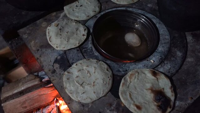 Traditional fire stove with egg and tortillas. Tradidional log stove in Guatemala, Central Americca.