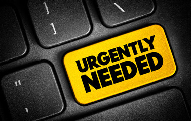 Fototapeta premium Urgently Needed text button on keyboard, concept background