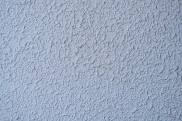 The uneven plastered walls are painted soft white for the background.