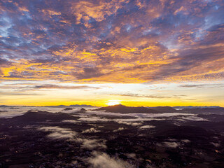 Aerial View of Mesmerizing Sunrise. Nature's Canvas Ignites. A Mesmerizing Sunrise Paints the...