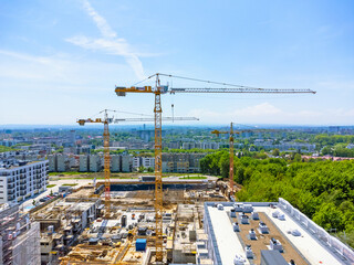 Aerial view landscape. Drone view of modern housing estate, apartment blocks, under construction, cranes, renovation.