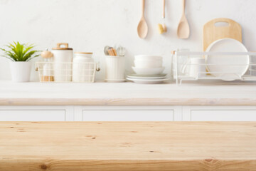 Empty wooden table top on blurred kitchen room counter background