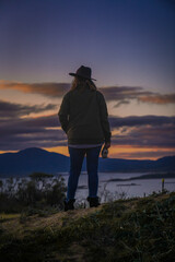 silhouette of a person in the mountains