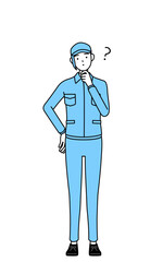 疑問を持って首をかしげる帽子と作業着姿の女性