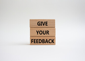 Feedback symbol. Concept word Give your feedback on wooden blocks. Beautiful white background. Business and Ask for feedback concept. Copy space