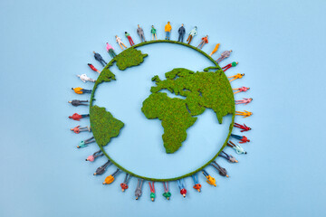World Population Day, creative concept. Large and diverse group of people in the shape of the world...