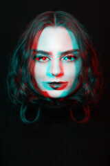 Beautiful woman with make-up close-up studio portrait in RGB color split effect style. Model looking at camera with seductive eyes. Wearing black sweater. Futuristic looking style