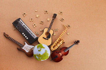 Happy world music day. Musical instruments with globe background. © vetre