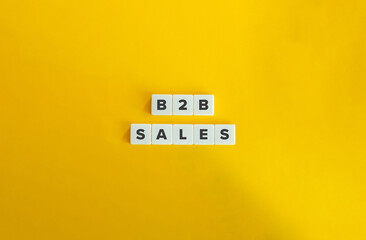 B2B Sales Banner and Concept. Block Letter Tiles on Yellow Background. Minimal Aesthetic.