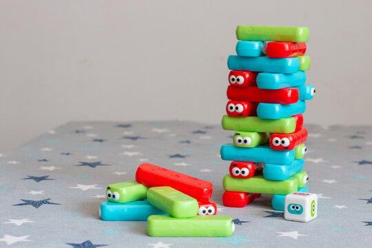 Classic children's game of colored plastic blocks, which consists of choosing a color, removing it and if you knock down the building, you lose. Known as Jenga or Kapla