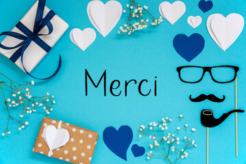 Blue Flat Lay With Accessories, Gifts, Hearts, Text Merci Means Thank You