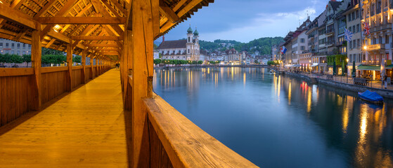 The Legendary Wooden Chapel Bridge, Revealing Lucerne's Old Town Splendor in Switzerland