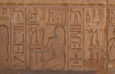 Ancient egyptian hieroglyphs carved on stone at Karnak temple, Luxor, Egypt 