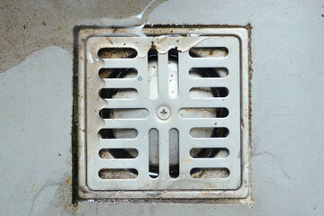 Clogged and dirty sewer pipes floor drain at bathroom