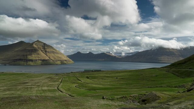 Panoramic shot of Fuglafjordur city, on Eysturoy Island during sunny day with clouds l,Faroe island