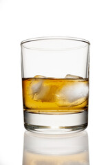 clean whiskey glass isolated on white background with a clipping path. Strong alcoholic cocktail with ice in a low glass isolated on white background